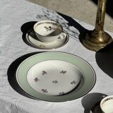 Set of 9 vintage turquoise deep plates with gold trim and pink flowers.