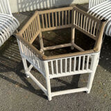 Rattan lounge with two two-seater sofas and a white coffee table.