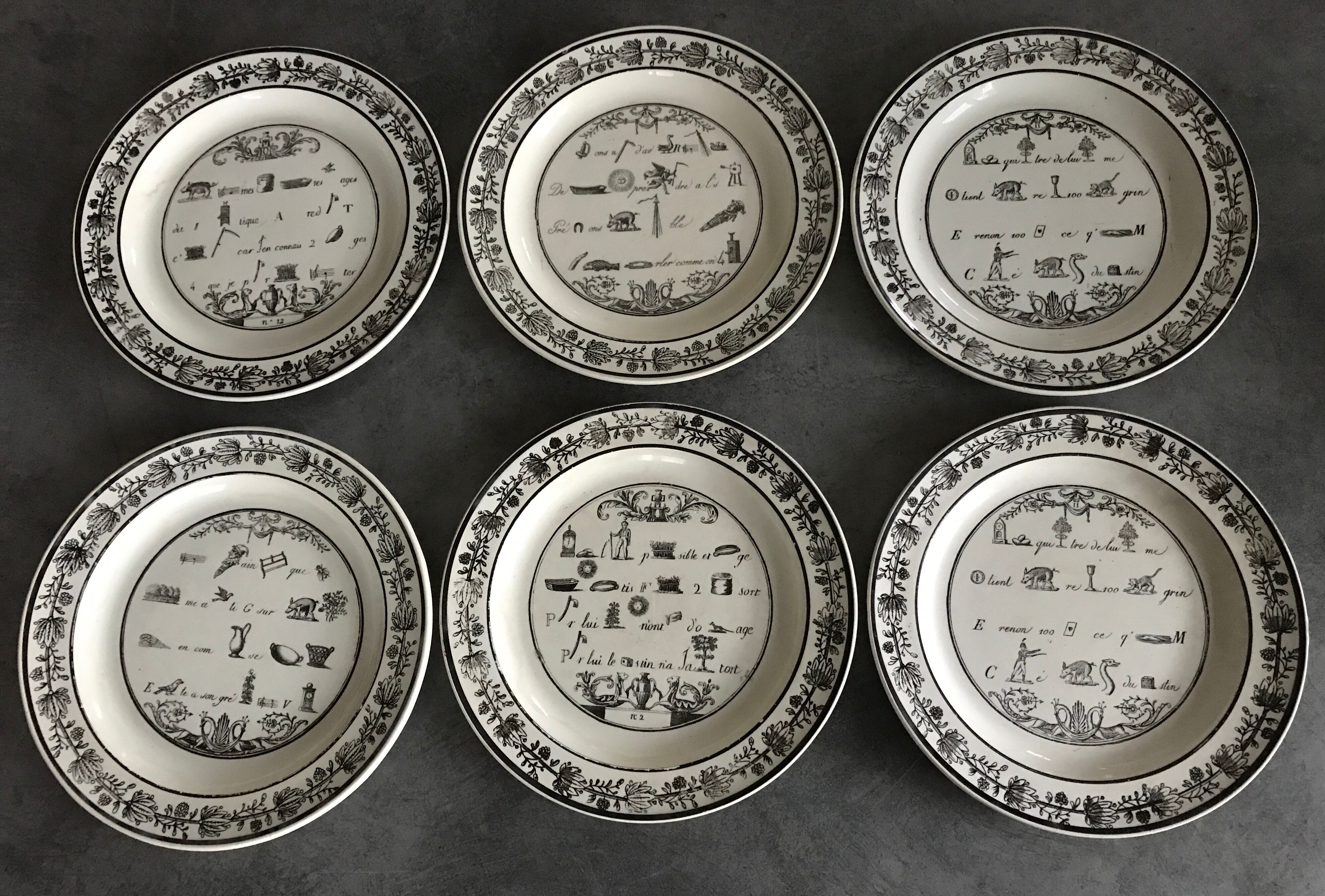 Lot of 6 plates in fine earthenware from choisy-le-roi, p&h, rebus décor; xixth