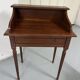 Old-fashioned secretary desk and chair set.