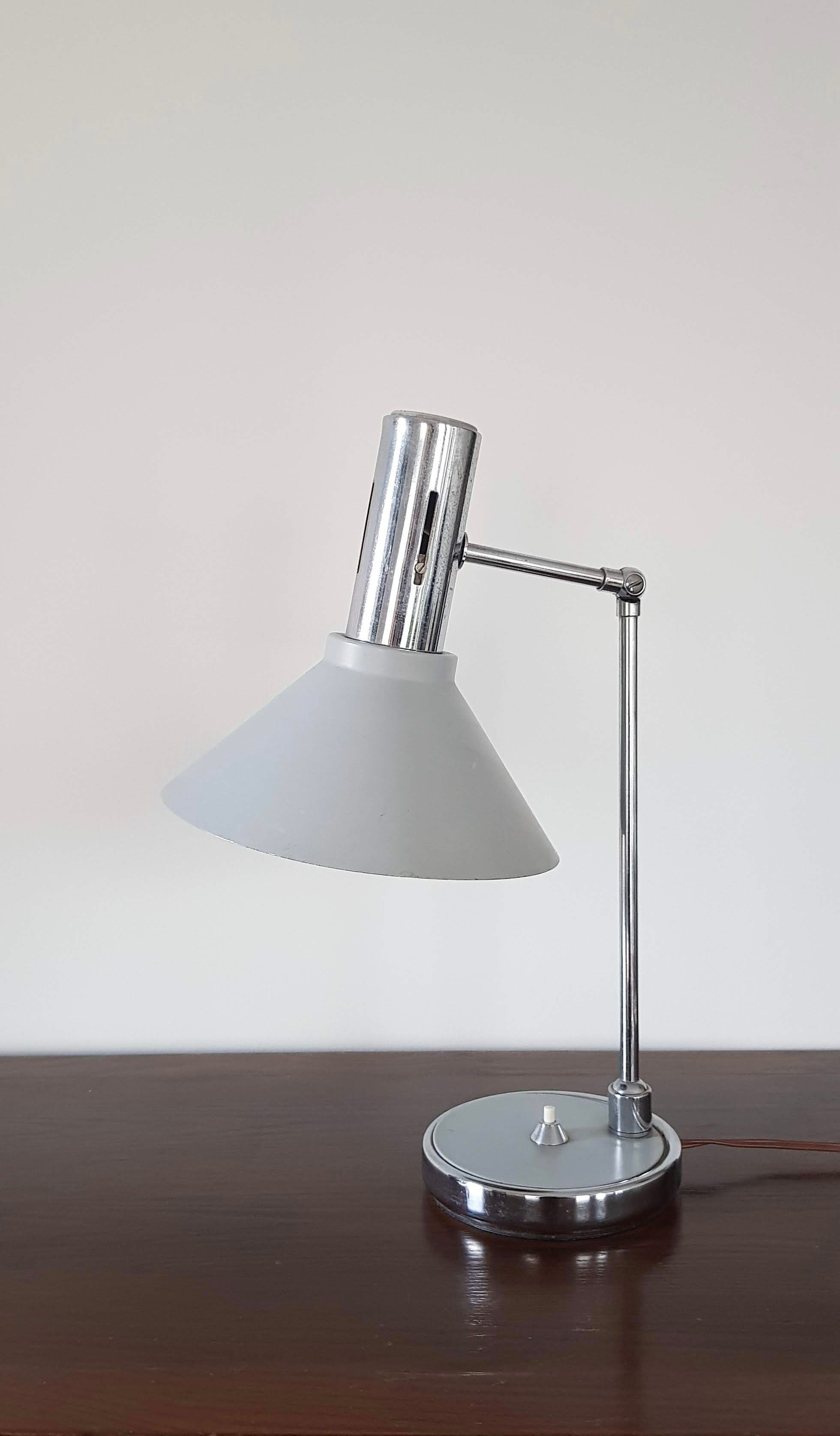 Chrome metal desk lamp and gray articulated arm