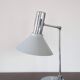 Chrome metal desk lamp and gray articulated arm