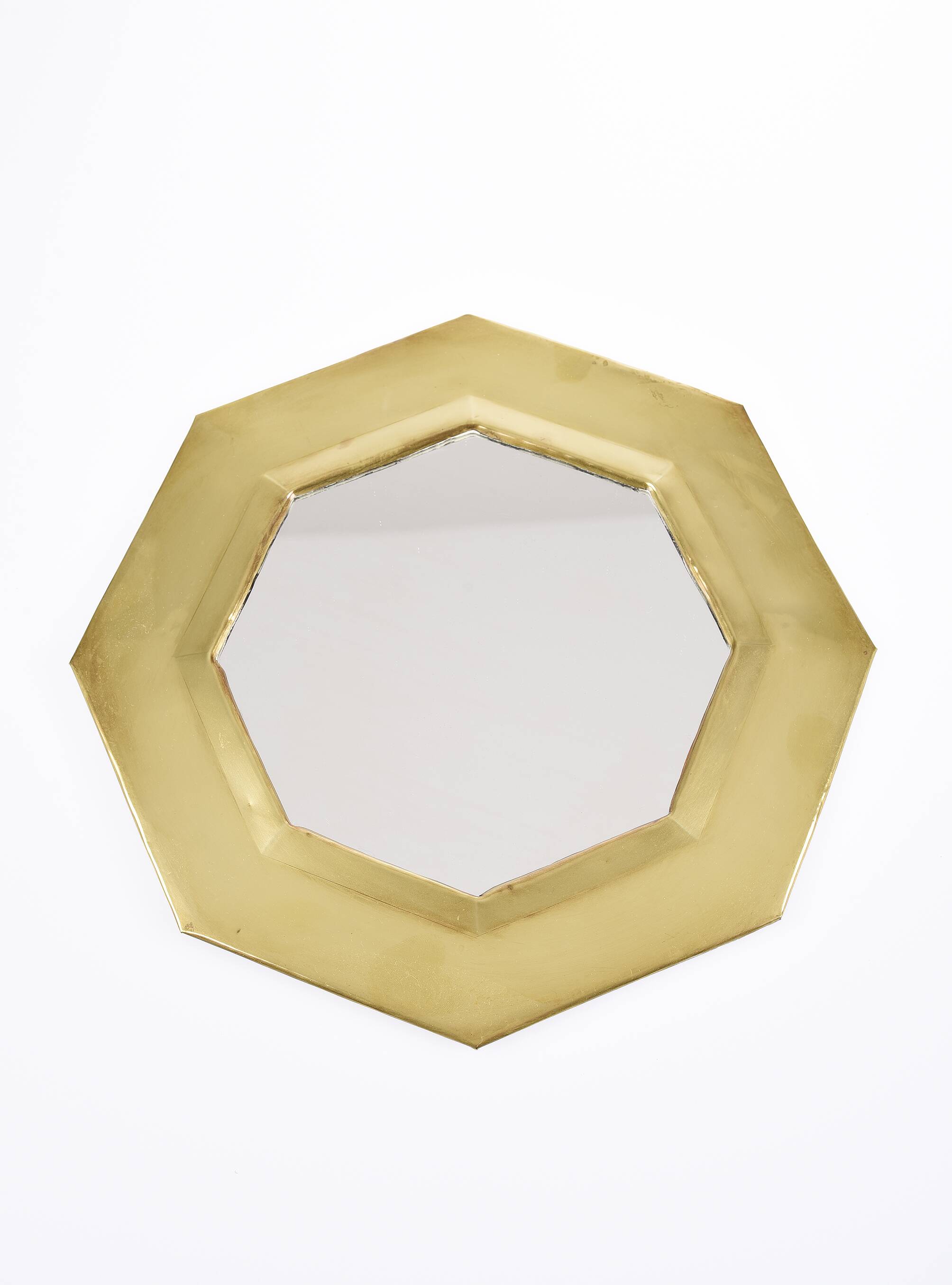 Old golden octagonal mirror, in brass