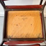Pair of vintage stacking chairs with red vinyl upholstery