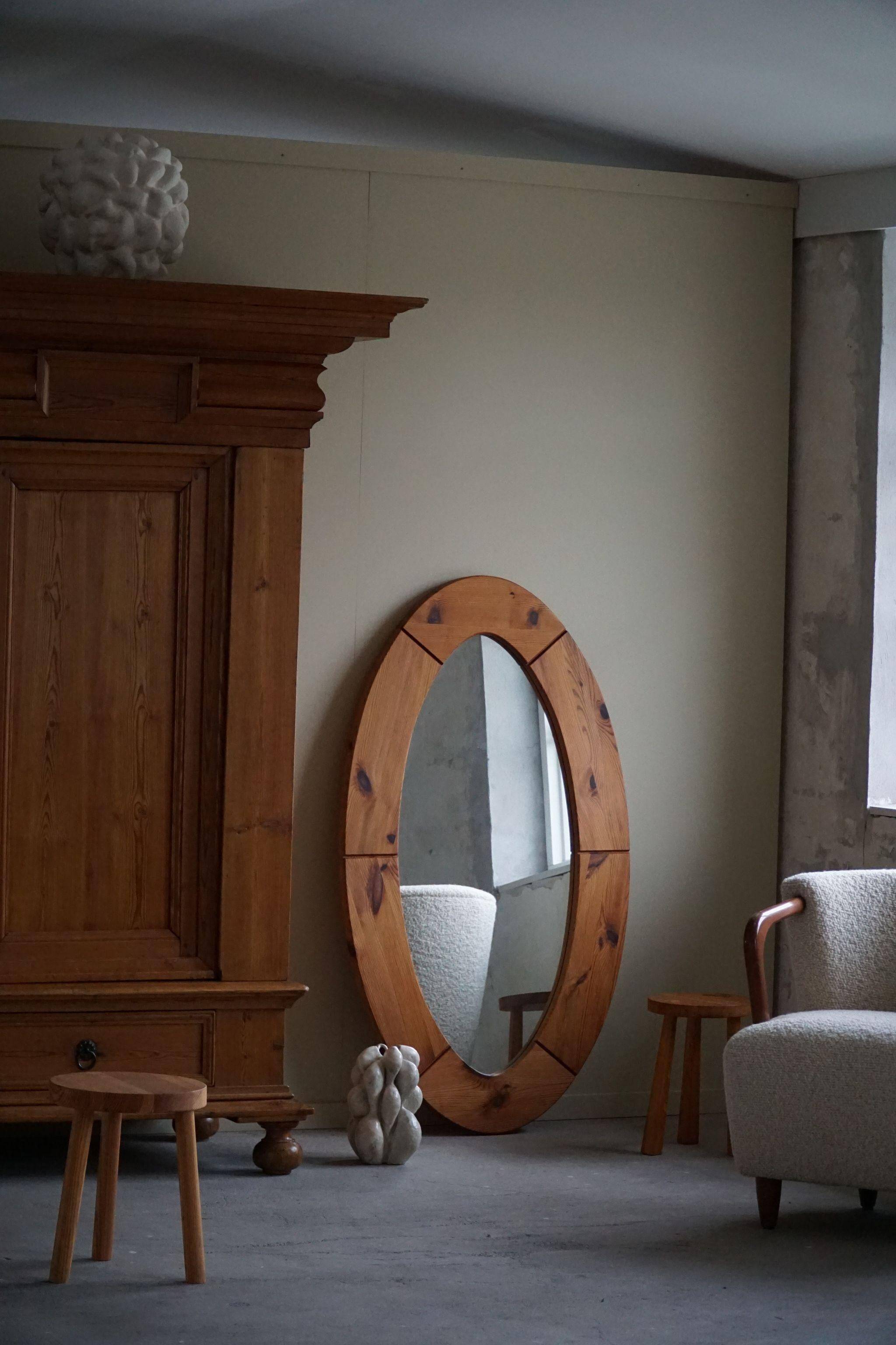Large oval wall mirror in solid pine by Glasmäster Markaryd, Sweden, 1960s.