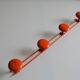 Vintage 70s orange lacquered metal 4-hook wall coat rack
