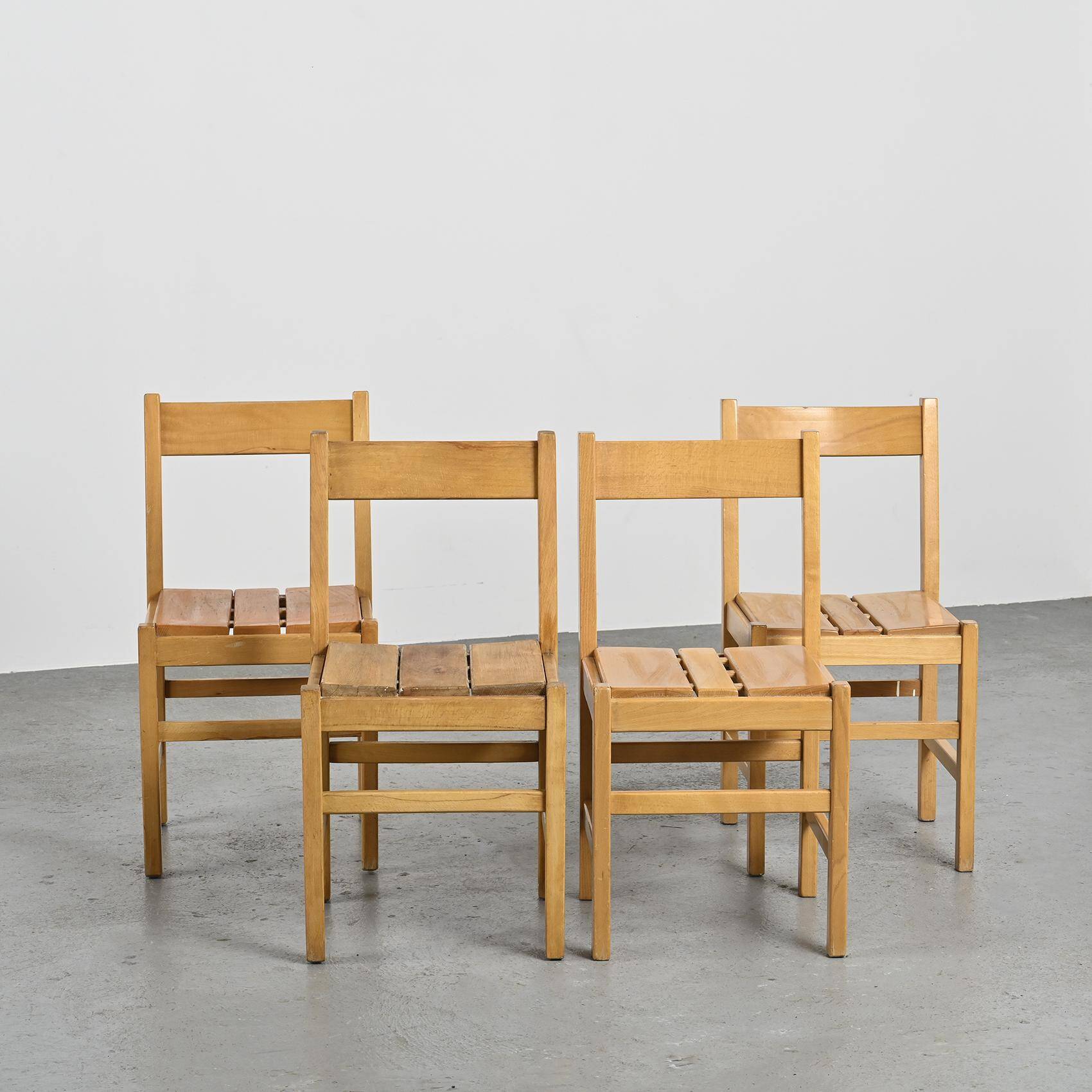 Suite of four chairs in the style of Maison Regain