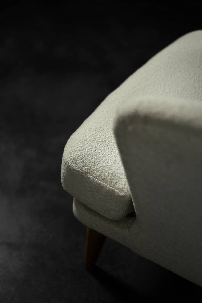 Low oak armchair with modern mid-century Scandinavian fabric and rounded backrest, 1960s.