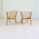 Mid-century lounge chairs in sheepskin/shearling and stained wood, Sweden, 1962.