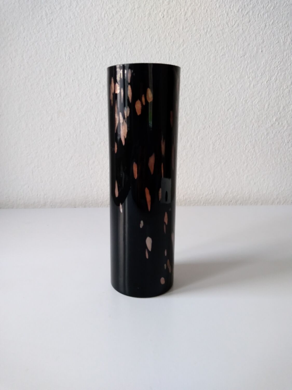 Black opaque glass vase with minimalist style copper inlays