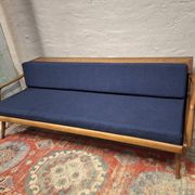 Sofa-lit convertible en teck danois avec compartiment pour dossier, années 1960.