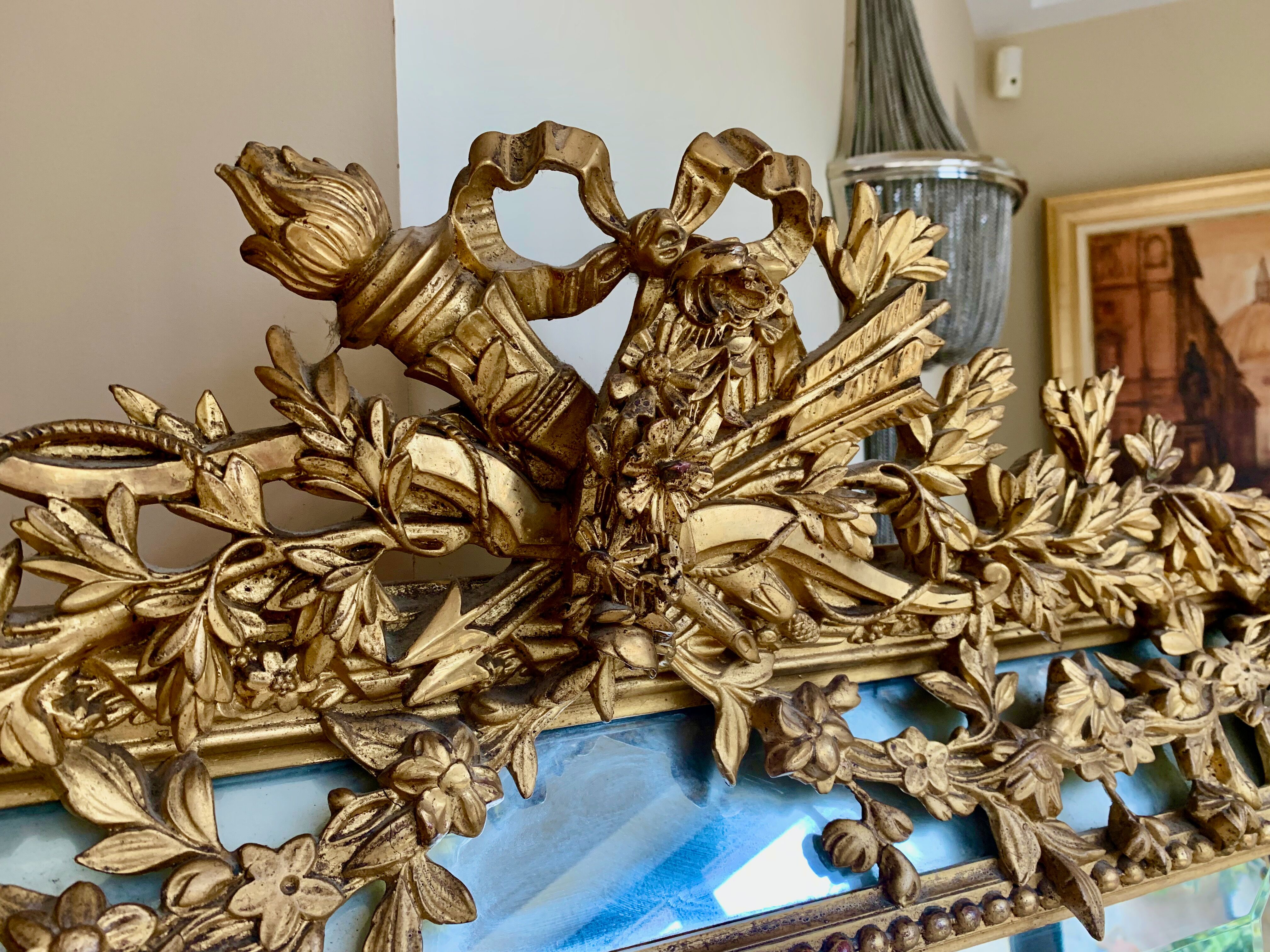 Large mirror style Louis XVI in gilded wood with parecloses xixth h: 165 cm