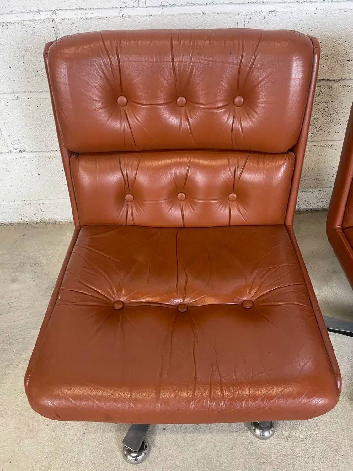 Pair of brown leather armchairs 1980