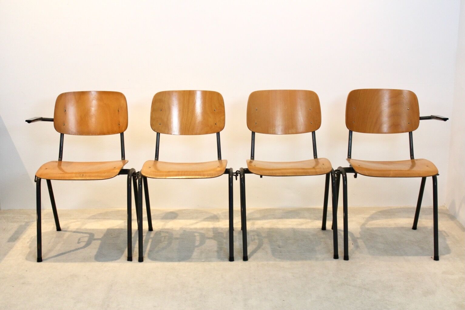 School bench consisting of 4 stackable chairs in industrial plywood by Marko Holland