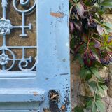 Entrance door in solid oak, cast iron grille, 1930s