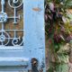 Entrance door in solid oak, cast iron grille, 1930s