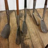 Old golf bag with 5 golf clubs