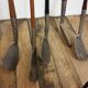 Old golf bag with 5 golf clubs