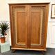 Armoire rotin pieds compas