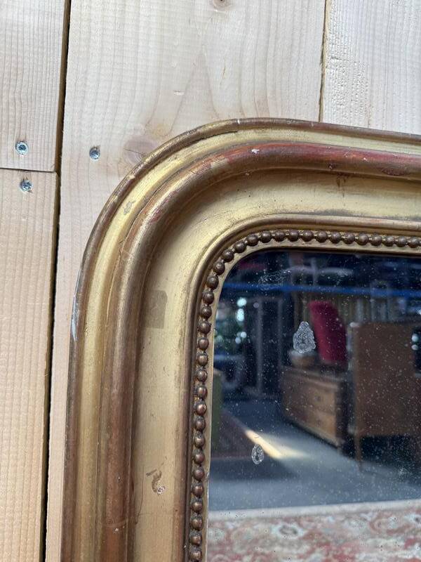 Miroir époque Louis Philippe à la feuille d'or.