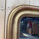 Miroir époque Louis Philippe à la feuille d'or.