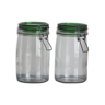 Pair of transparent glass jars and green lid
