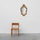 French Rococo or Baroque style facet-cut crest mirror in gilded carved wood