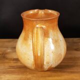 The stoneware pitcher