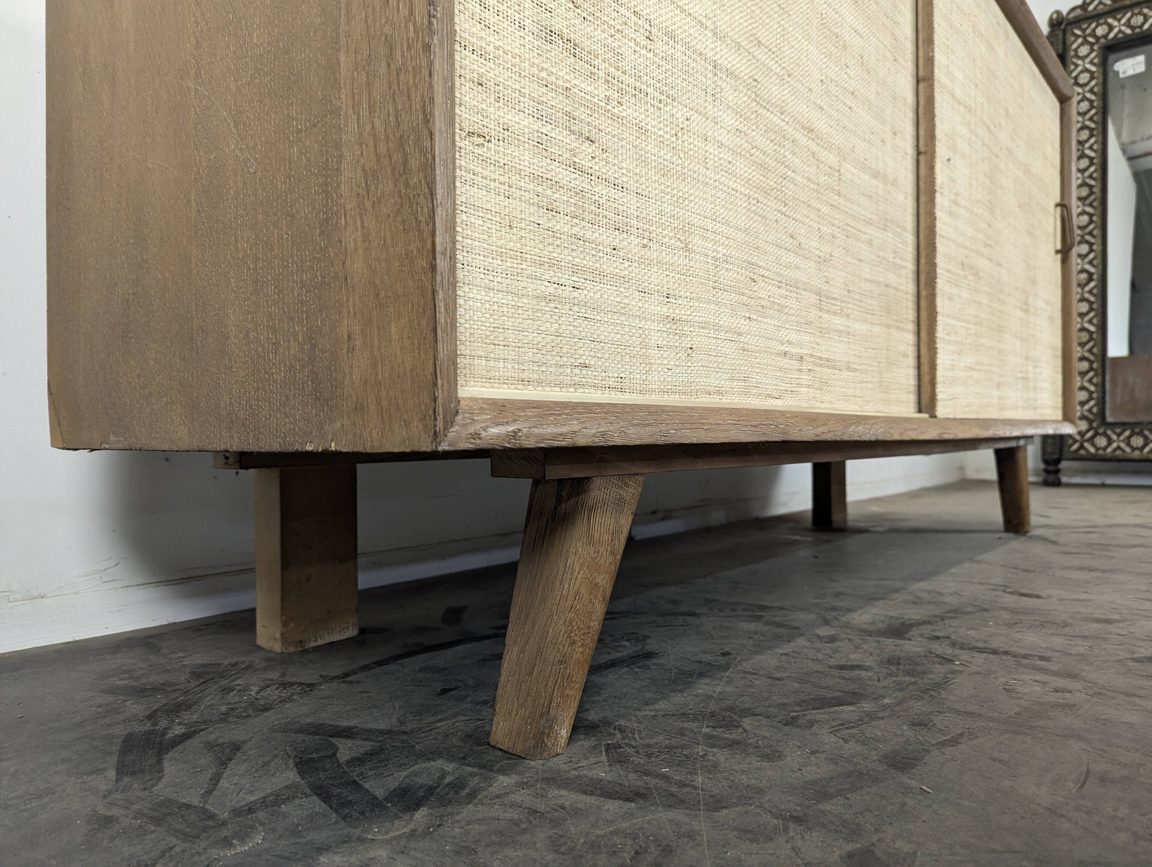 Modernist sideboard in oak with rattan doors.