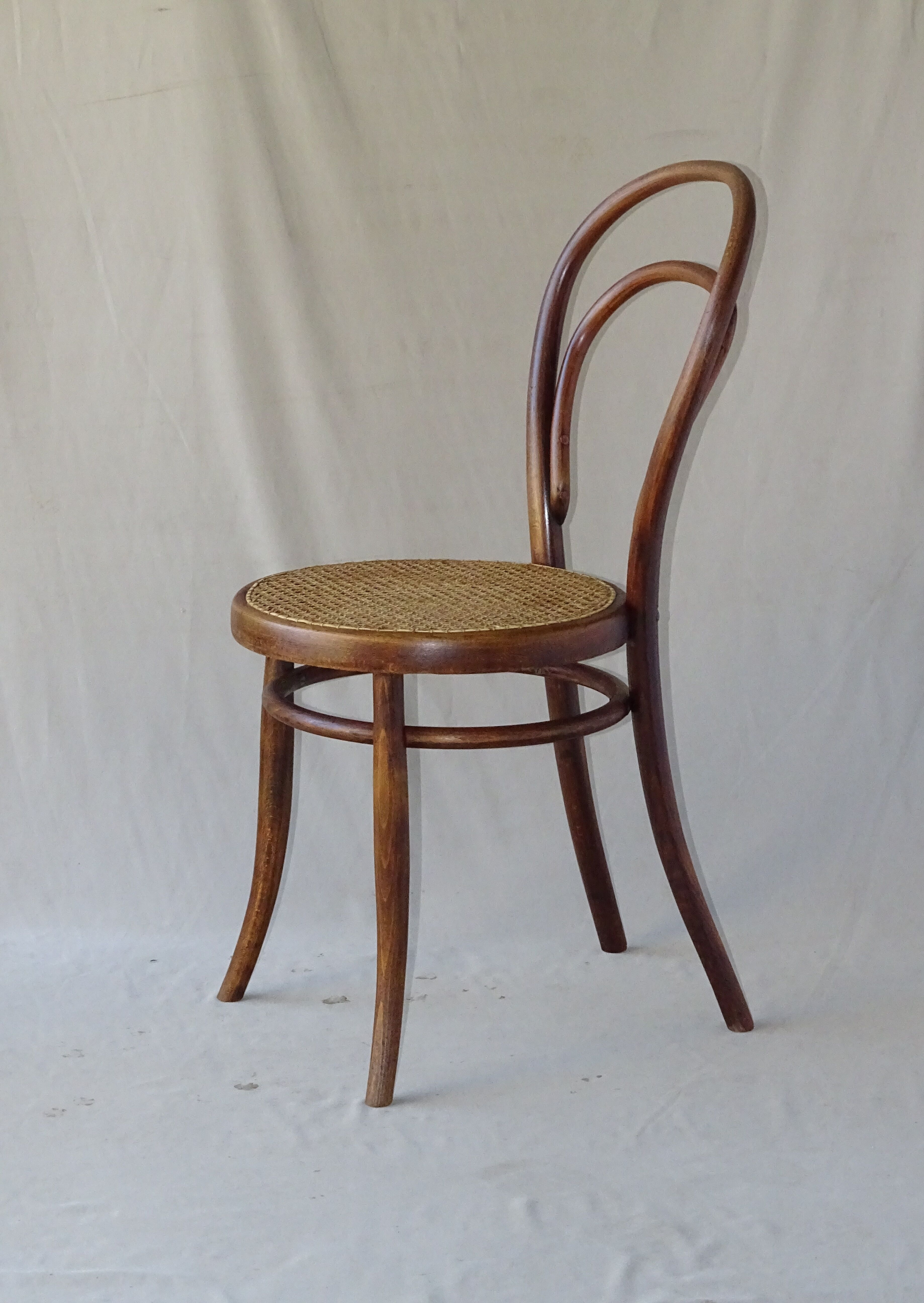 Two Turpe canned Bistro 1900 color rosewood chairs