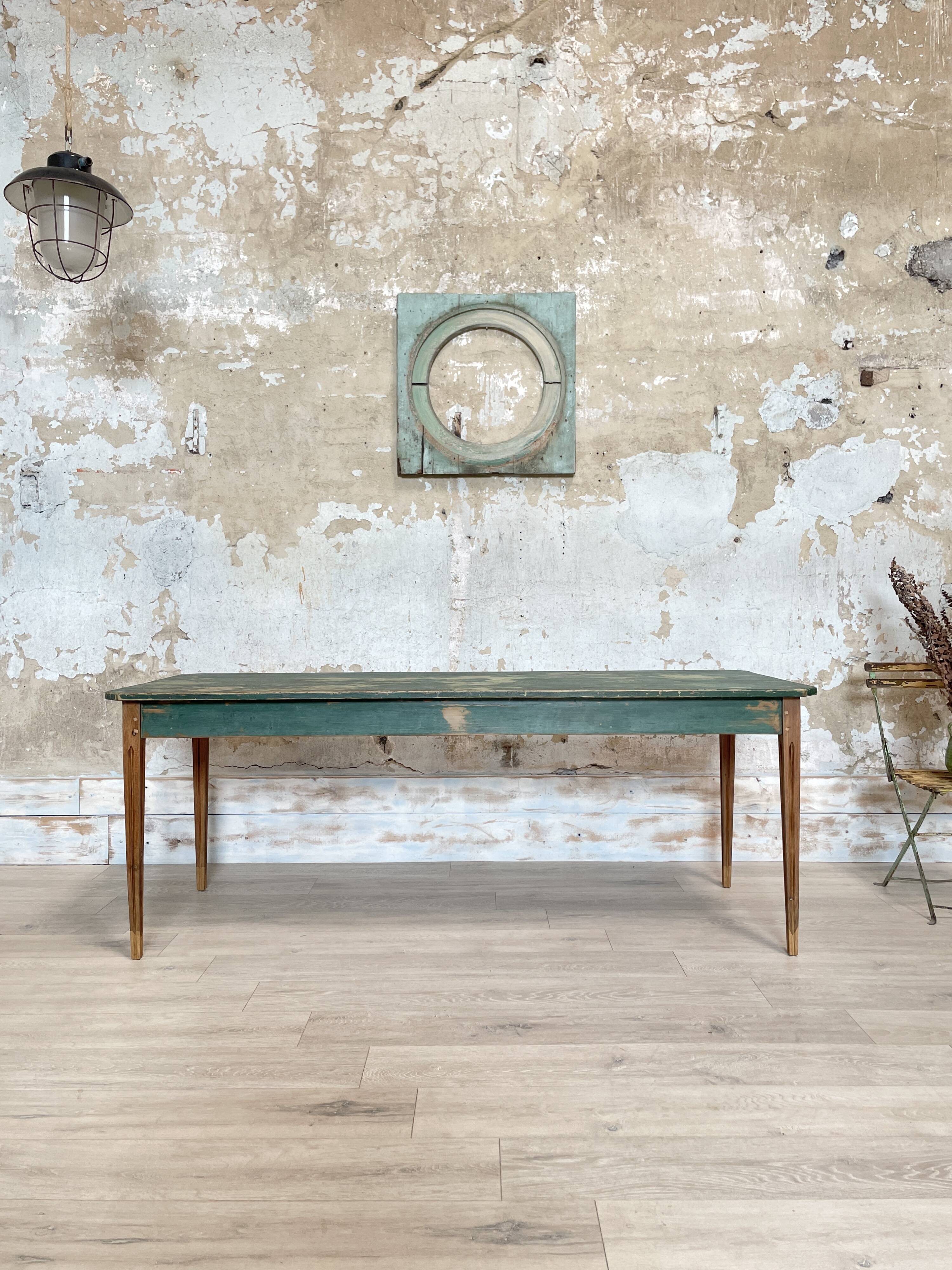 Vintage farm table with spindle legs.