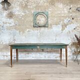 Vintage farm table with spindle legs.