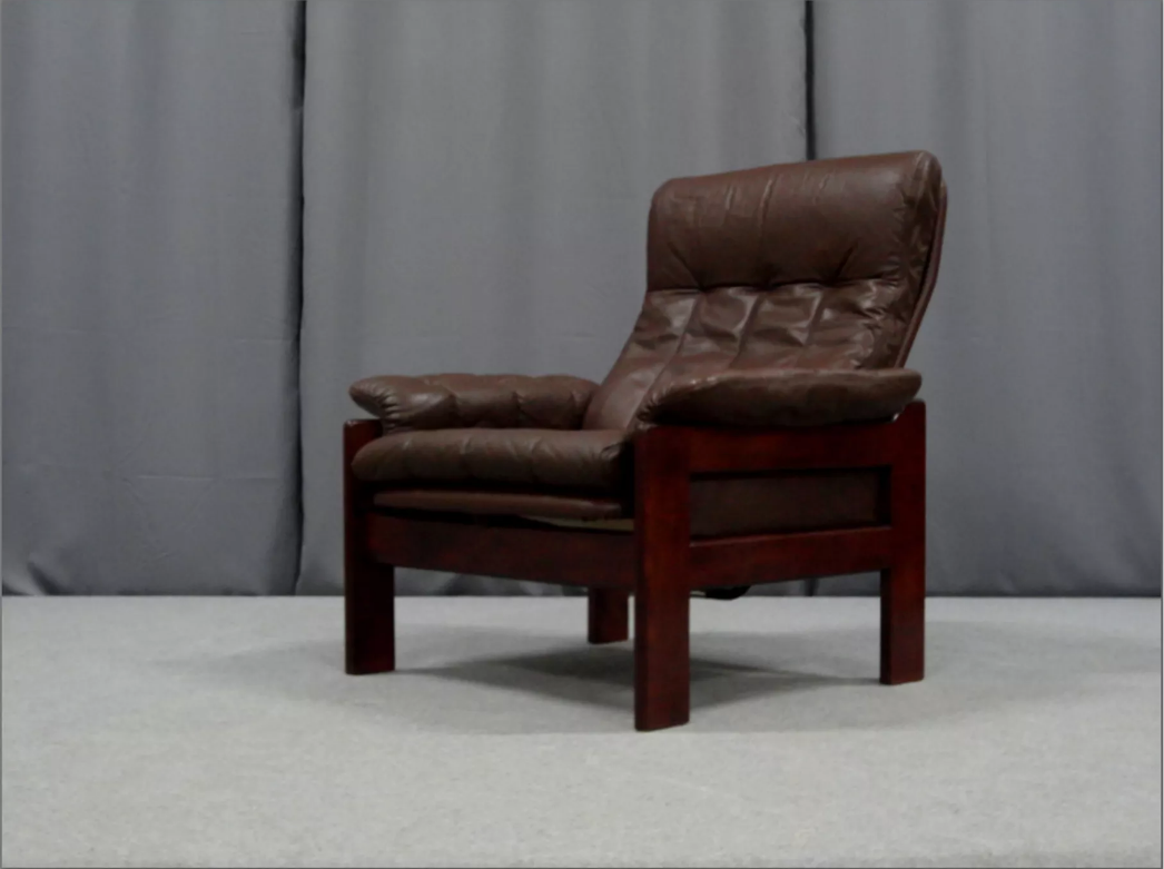 Pair of armchairs and ottoman in leather, 1970