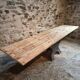 Old French industrial table with a cast iron base and a pine top.