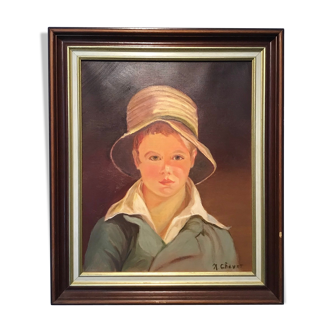 Portrait of a young boy in a straw hat, 70s