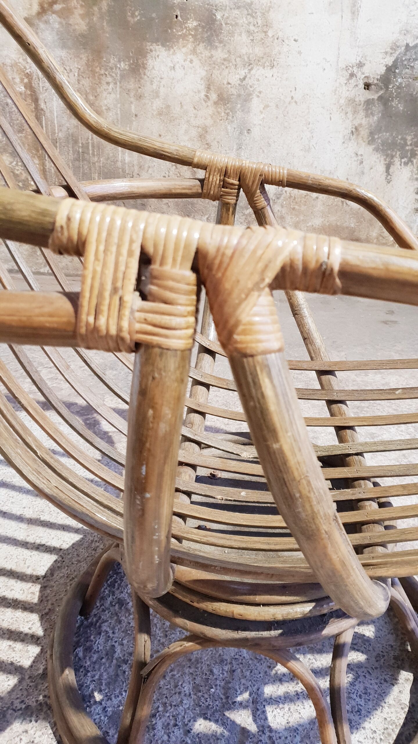 Antique swivel rattan armchair