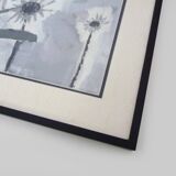 Framed painting with gray flower decor.