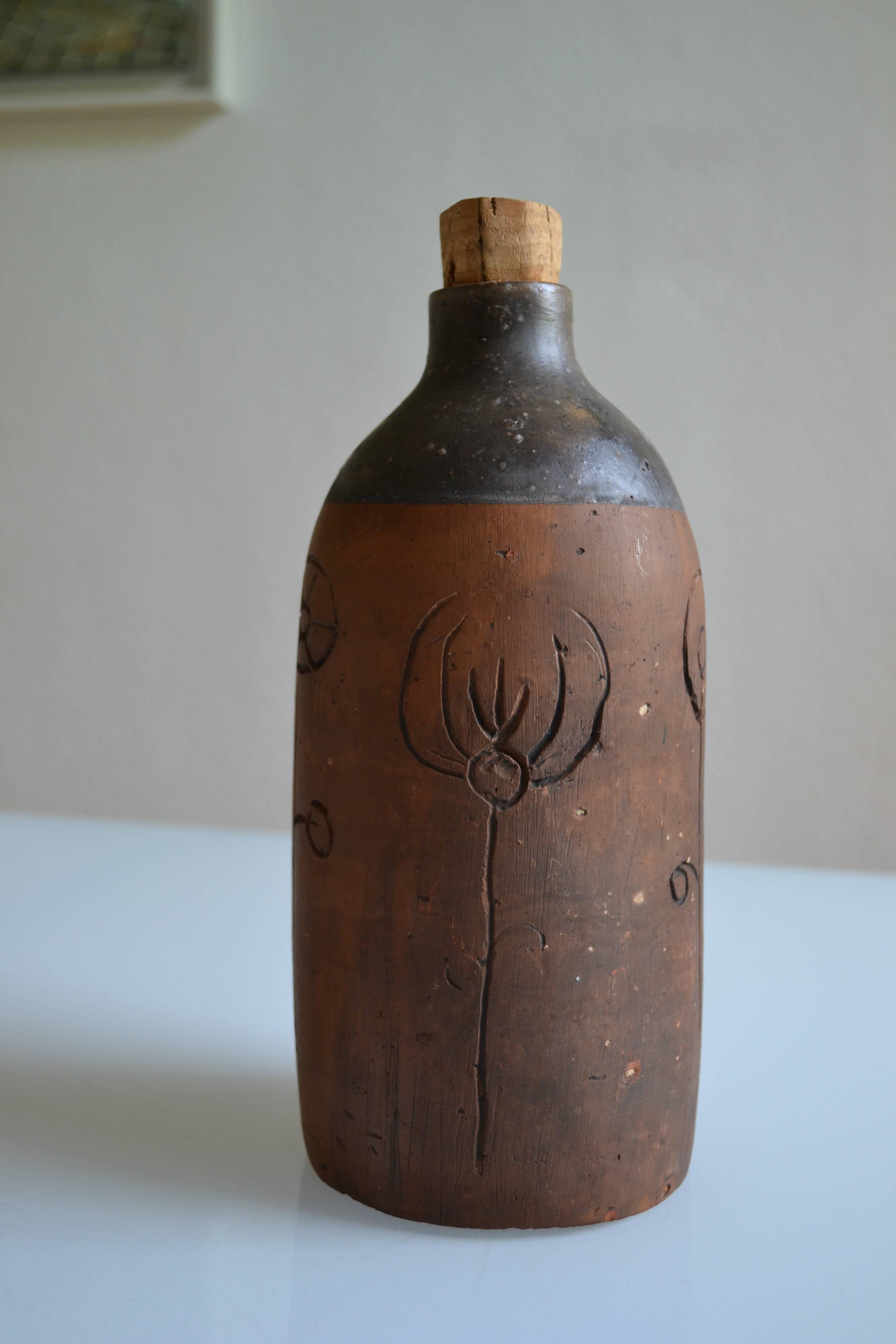 Bottle vase decorative flowers ceramic signature with fish to identify.