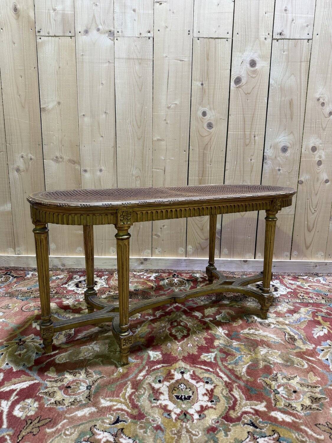 Bench - Piano bench in caning and gilded wood in the Louis XVI style.