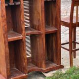 Exotic wood bar with 2 high stools.