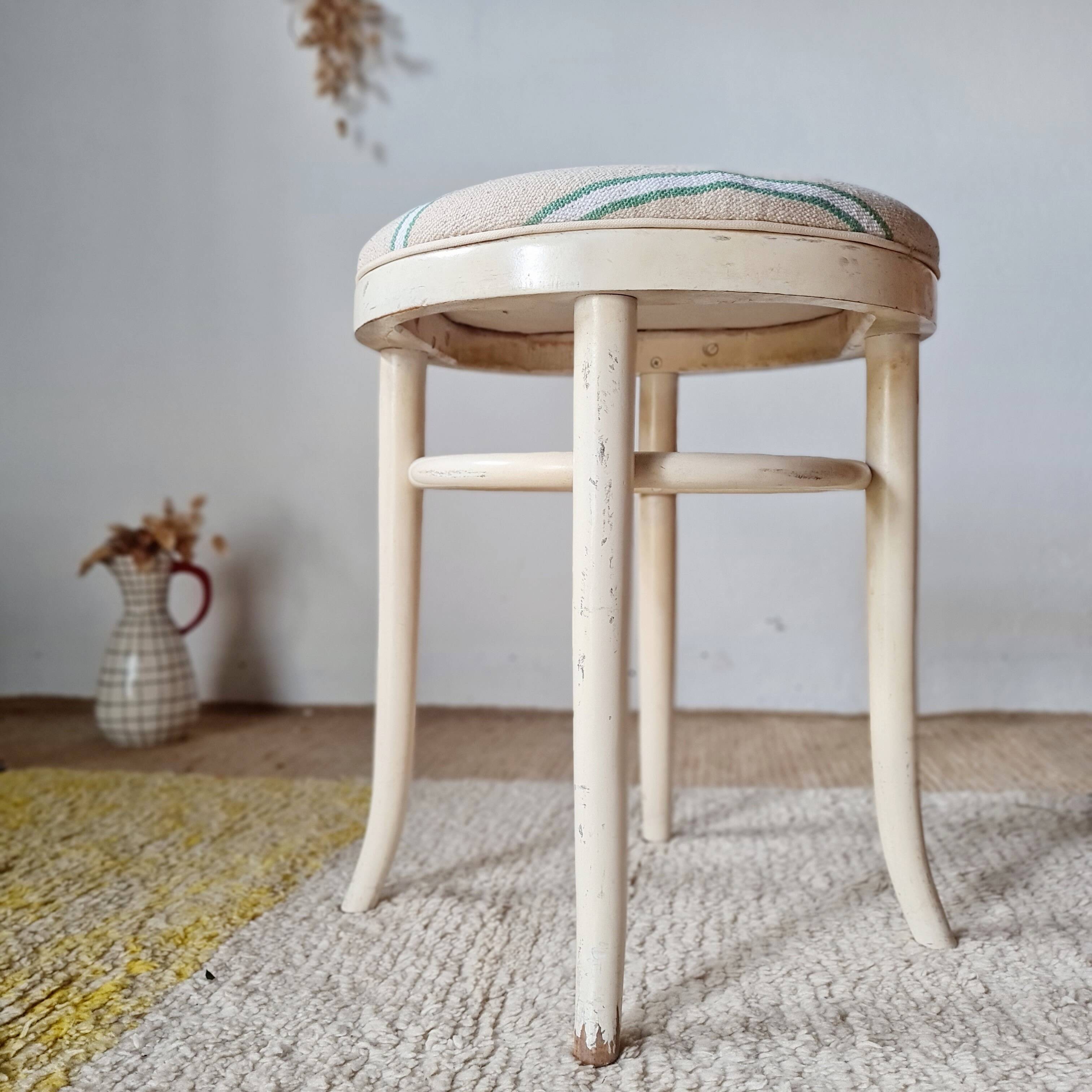 Vintage curved wooden stool in Baumann style, striped fabric seat.
