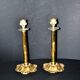 Lot of 2 antique brass and gilded bronze candle holders with acanthus decoration.