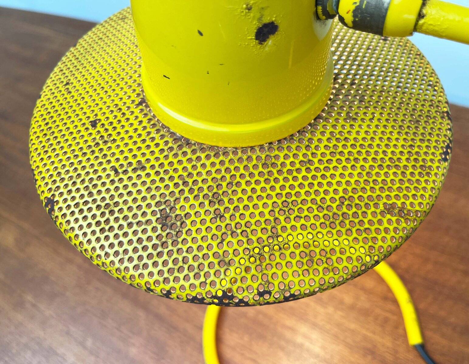 Perforated metal table lamp in Mid-Century Modern style, in the style of Mathieu Matégot, 1960s.