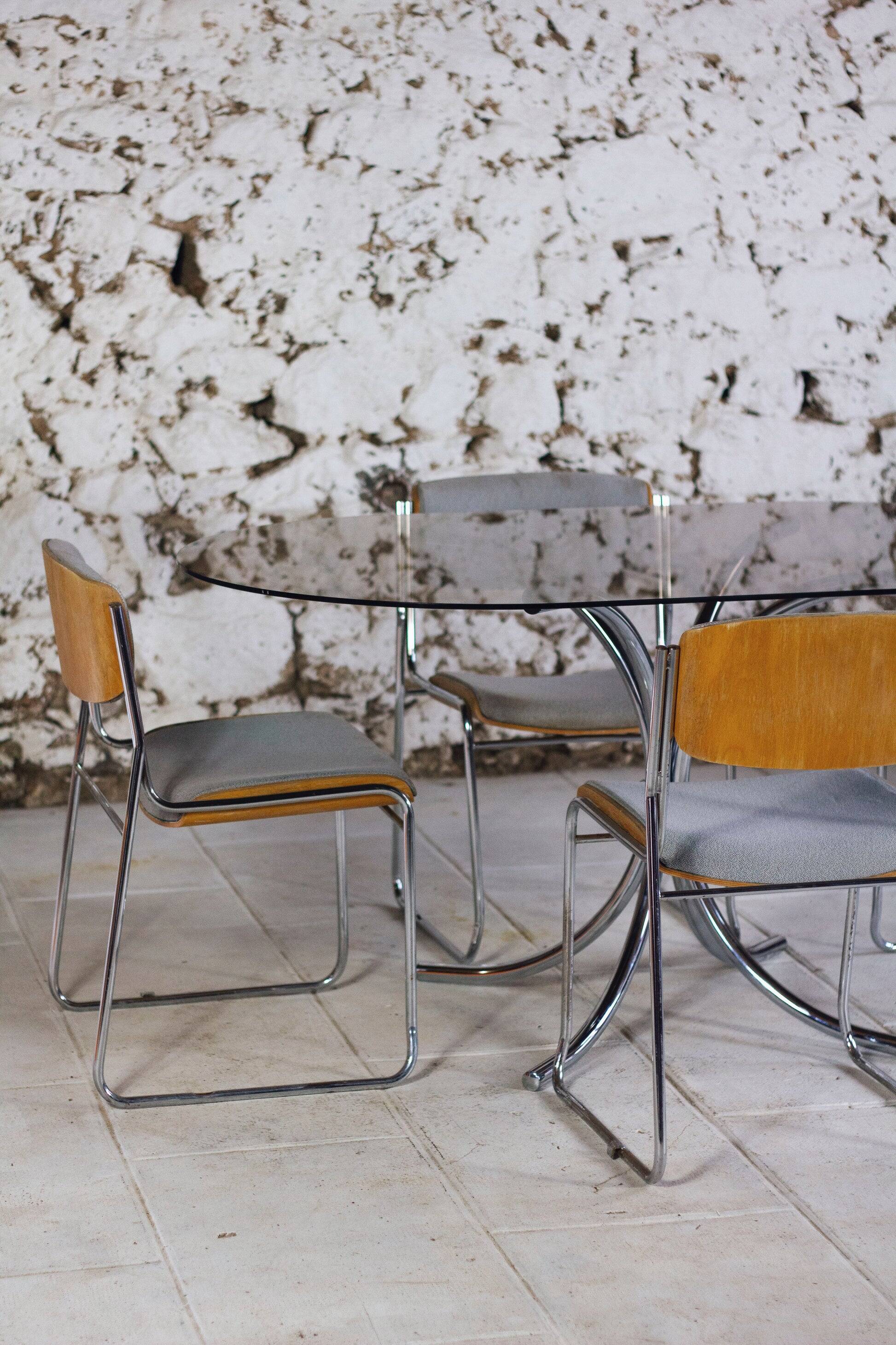 Oval dining table in chrome and smoked glass, 1970.