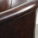 Dark cow leather club armchair in good condition with an English design