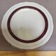 Salins white ceramic dessert plates with red trim and gold rim.