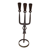 Brutalist iron candlestick on a stand