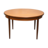 Round Scandinavian table with extension cords