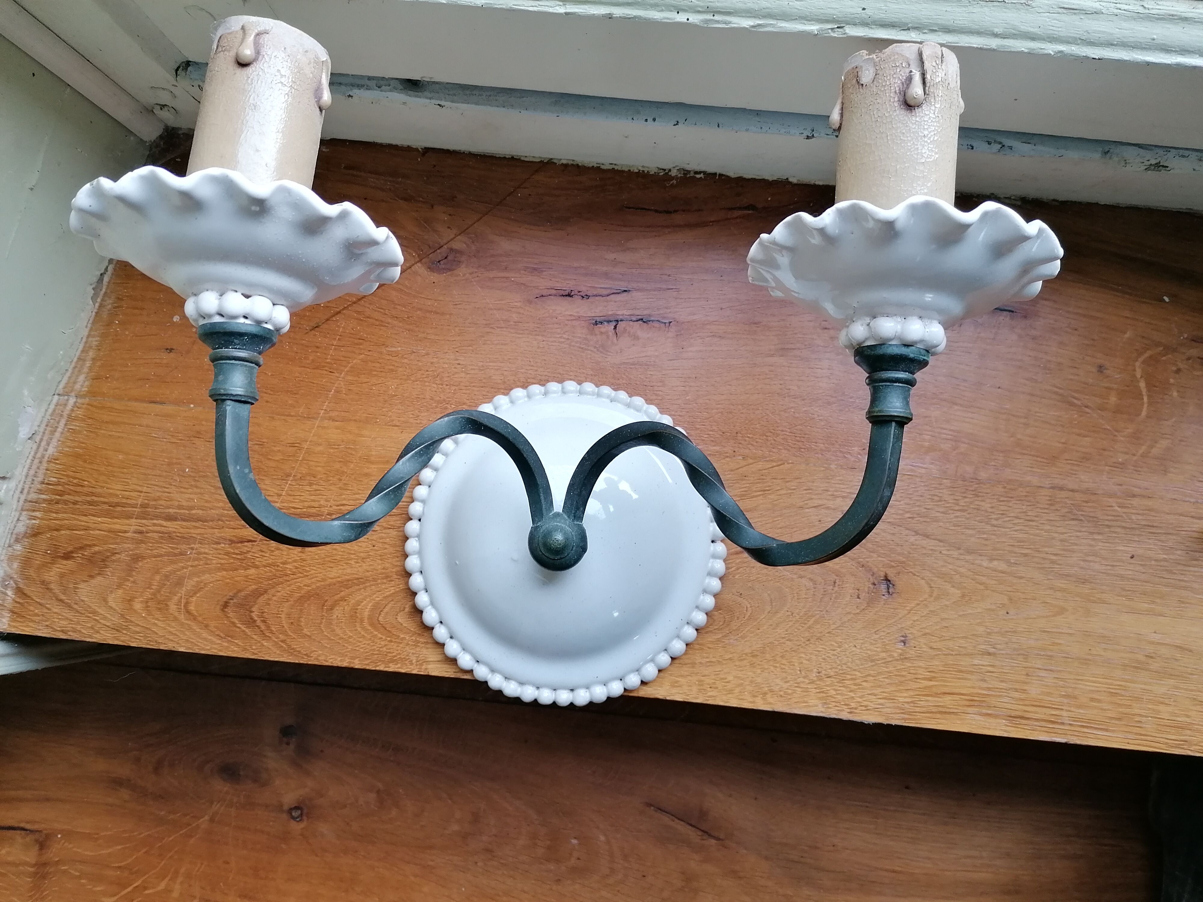 Pair of white faience wall lamps