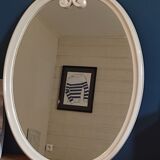 Oval mirror patinated white enamelled metal frame